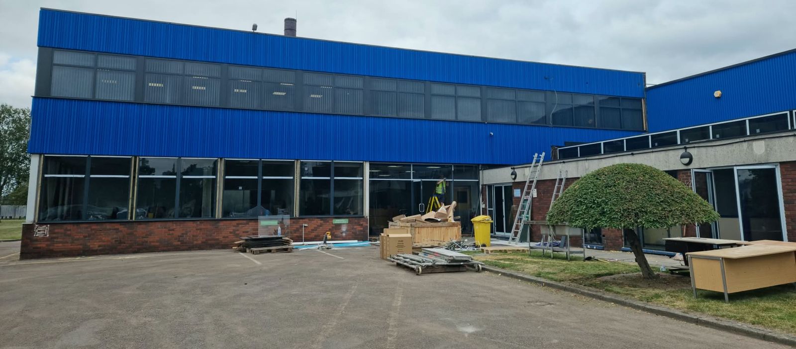 Two-storey commercial building with new aluminium glazing at ground and first floor