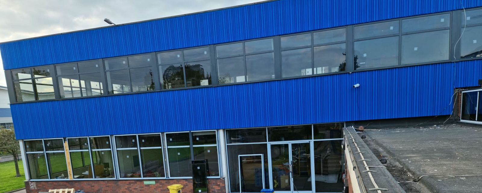 Commercial building with a long run of new first-floor aluminium windows